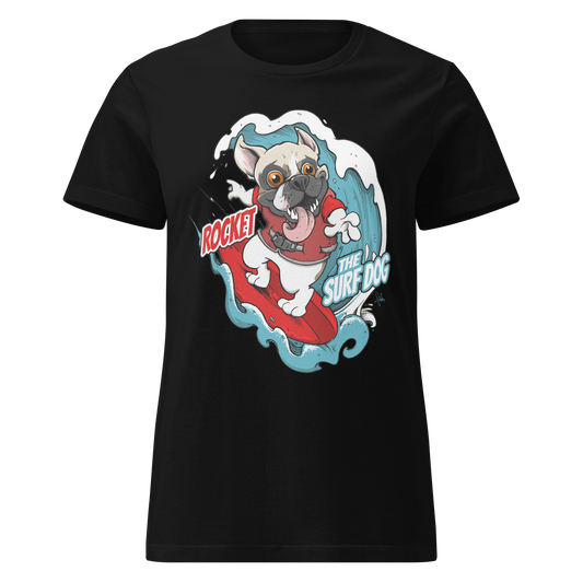 A black short-sleeve crewneck t-shirt featuring a cartoon graphic of a white French Bulldog surfing on a red board with blue waves, accompanied by the text 'ROCKET THE SURF DOG'.