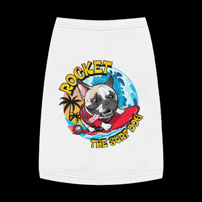 A white pet shirt featuring a colorful graphic of a French Bulldog surfing on a red board with the text 'ROCKET THE SURF DOG' in yellow and blue.
