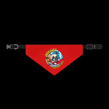 A red dog bandana with a black adjustable strap and buckle, featuring a colorful cartoon graphic of a dog wearing sunglasses and the text 'ROCKET DOG THE STAR STAGGER'.