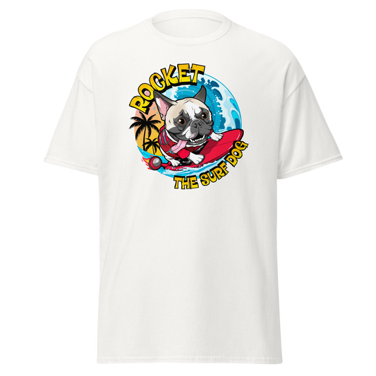 A white short-sleeve crewneck t-shirt featuring a colorful graphic print of a French Bulldog surfing on a red surfboard with the text 'ROCKET THE SURF DOG' in yellow.