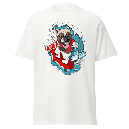 A white short-sleeve crewneck t-shirt featuring a colorful graphic print of a French Bulldog surfing on a red surfboard with the text 'ROCKET THE SURF DOG.'