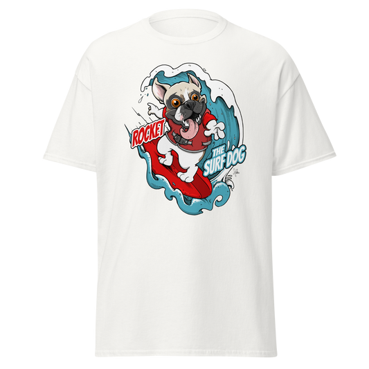 A white short-sleeve crewneck t-shirt featuring a colorful graphic print of a French Bulldog surfing on a red surfboard with the text 'ROCKET THE SURF DOG.'