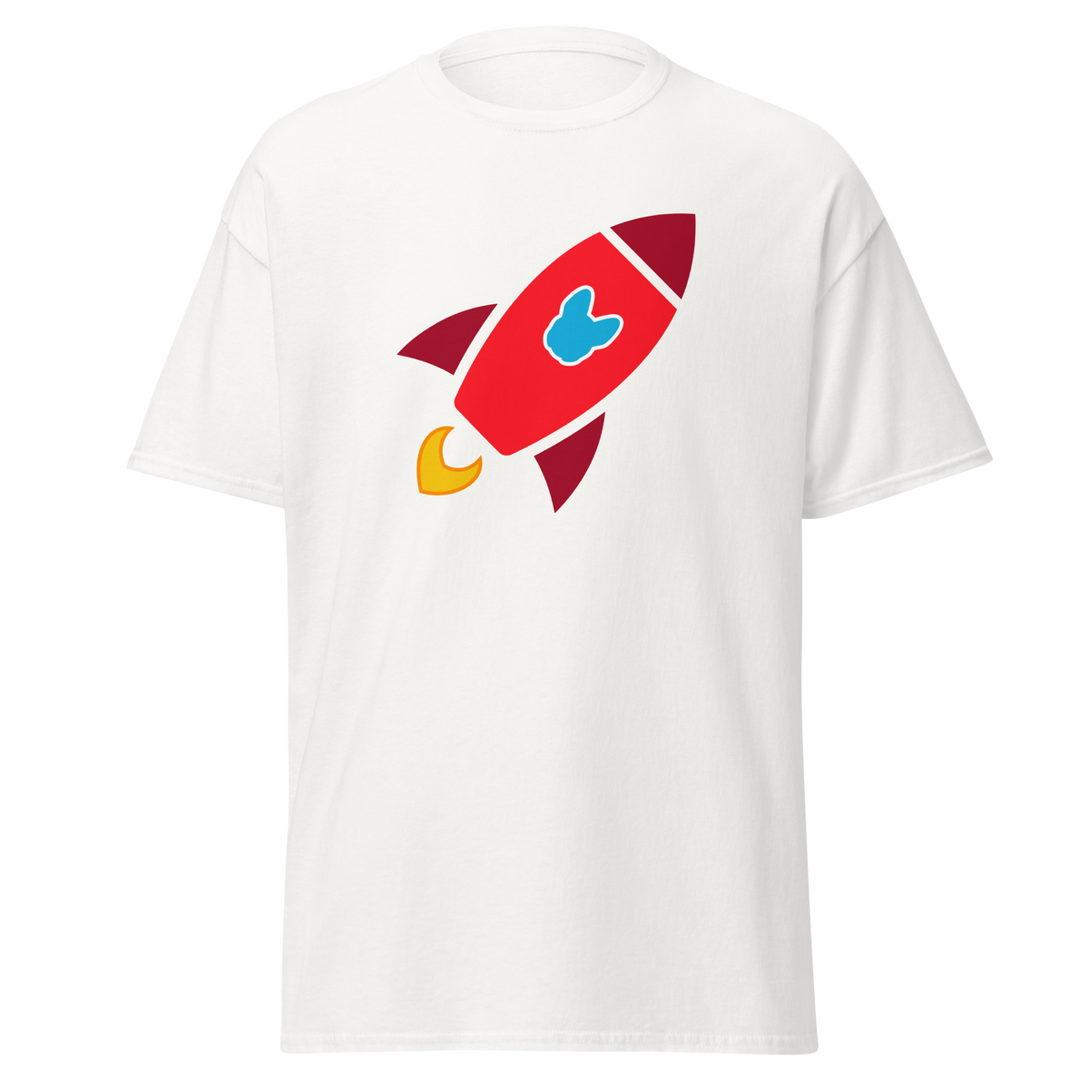 A white short-sleeve crewneck t-shirt featuring a cartoon rocket graphic on the chest. The rocket is primarily red with dark red accents, a light blue Frenchie-shaped logo in the center, and yellow flames at the base.