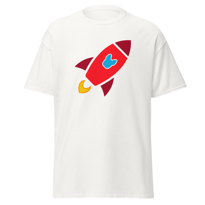 A white short-sleeve crewneck t-shirt featuring a cartoon rocket graphic on the chest. The rocket is primarily red with dark red accents, a light blue Frenchie-shaped logo in the center, and yellow flames at the base.