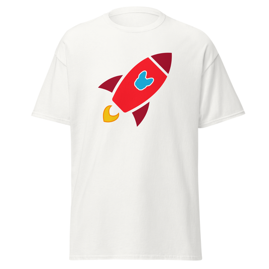 A white short-sleeve crewneck t-shirt featuring a cartoon rocket graphic on the chest. The rocket is primarily red with dark red accents, a light blue Frenchie-shaped logo in the center, and yellow flames at the base.