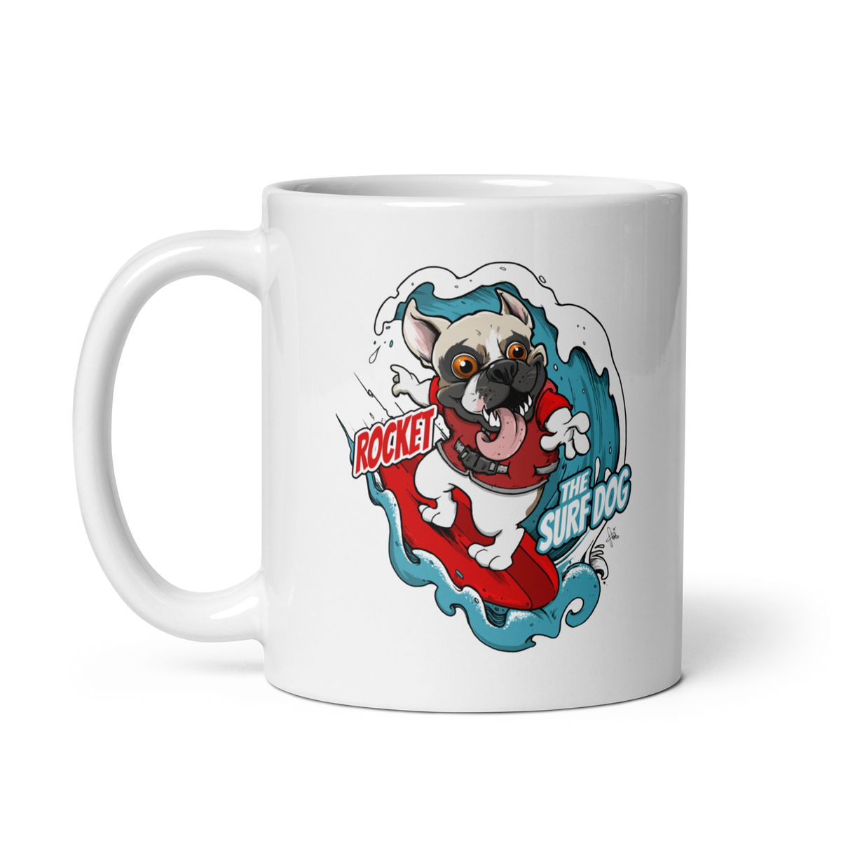 A white ceramic coffee mug featuring a cartoon graphic of a French bulldog surfing on a red board with blue waves and the text 'ROCKET THE SURF DOG'.