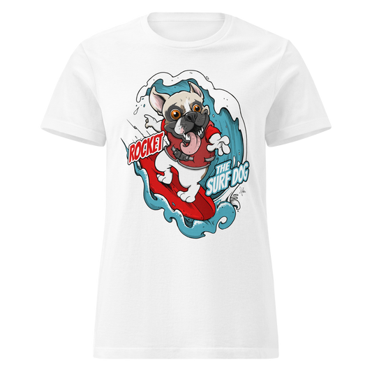 A white short-sleeve crewneck t-shirt featuring a cartoon graphic of a white French Bulldog surfing on a red board with blue waves, accompanied by the text 'ROCKET THE SURF DOG'.