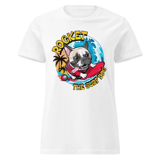 A white short-sleeve crewneck t-shirt featuring a colorful graphic print of a French Bulldog surfing on a red board with the text 'ROCKET THE SURF DOG' and a blue ocean background.